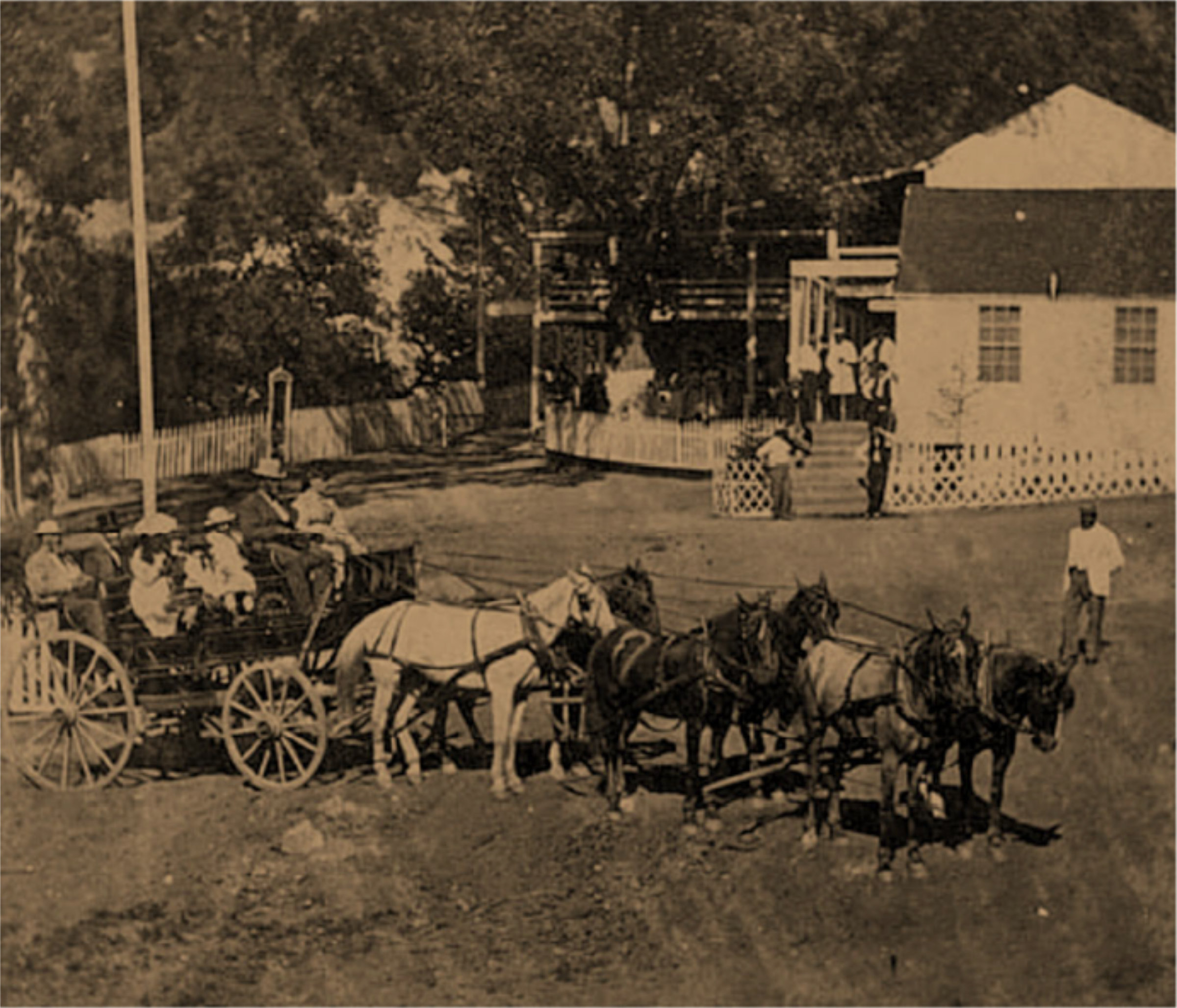Archival photo of Foss with passengers in horse-drawn cart